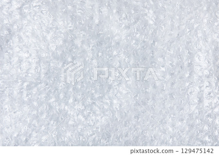 Abstract background made of white transparent bubble wrap packaging with space for text, offers, sale and discounts. Texture for creating backgrounds for designers and creative works. 129475142