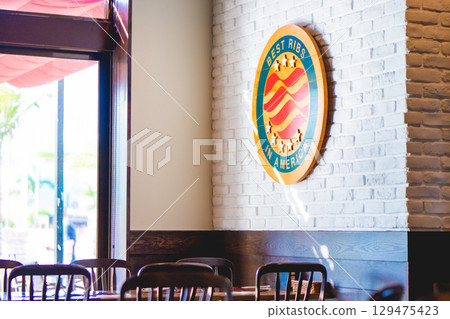 A bright cafe terrace bathed in sunlight 129475423