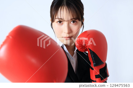 Businesswoman boxing image 129475563