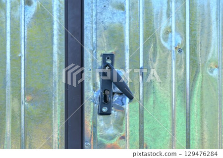 Broken lock after a break-in. Lock after a burglary. Insurance concept, risk of intrusion and security. Broken lock after a break-in. Lock after a burglary. Insurance concept, risk of intrusion and security. 129476284