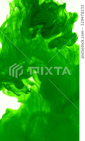 Green Ink Abstract Shape Under the Water. Isolated on White Background. Vertical Aspect Ratio. Green Ink Abstract Shape Under the Water. Isolated on White Background. Vertical Aspect Ratio. 129478232