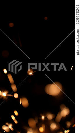 new year sparkler, fireworks. burning sparkler firework. Happy new year and Merry christmas concept. Happy holidays. Abstract blurred of Sparklers for celebration. Magic light. Winter Xmas decoration. new year sparkler, fireworks. burning sparkler firework. Happy new year and Merry christmas concept. Happy holidays. Abstract blurred of Sparklers for celebration. Magic light. Winter Xmas decoration. 129478261