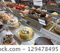 Cakes lined up in a showcase 129478495