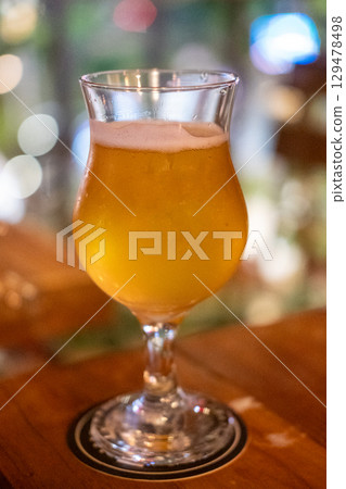 Glass of beer on the wooden table Glass of beer on the wooden table 129478498