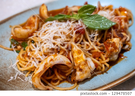 Squid spaghetti served on plate Squid spaghetti served on plate 129478507