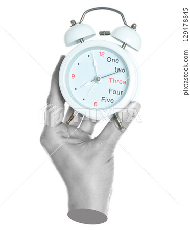 Woman hand holds alarm clock, isolated on transparent background, office and household items concept. Contemporary art 129478845