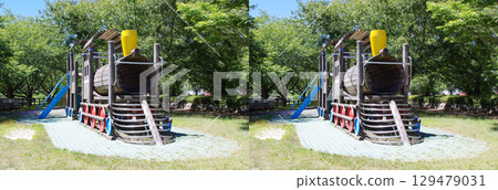 A stereogram that uses parallel stereoscopic vision to recreate the wooden playground equipment and surrounding scenery in a park. 129479031