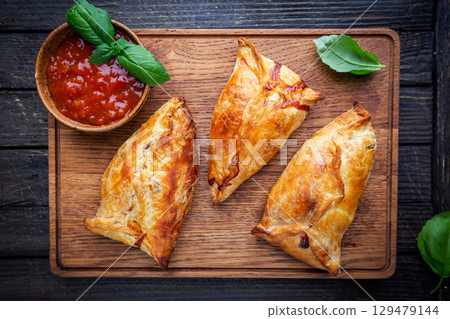 Samsa or samosas with chicken fillet Samsa or samosas with chicken fillet 129479144