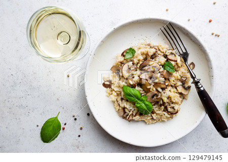 Risotto with mushrooms in a plate 129479145