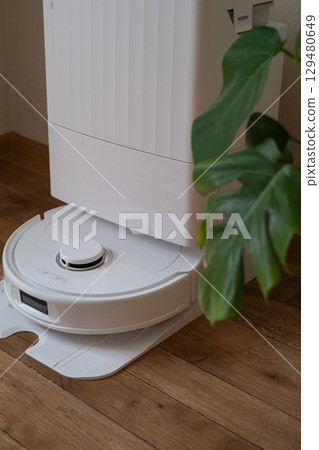 Cleaning help without effort or stress robot in action making home chores easier faster and more efficient every day 129480649