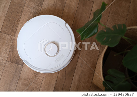 Robot vacuum operates autonomously stress free cleaning solution for busy lifestyles and modern smart home environments 129480657