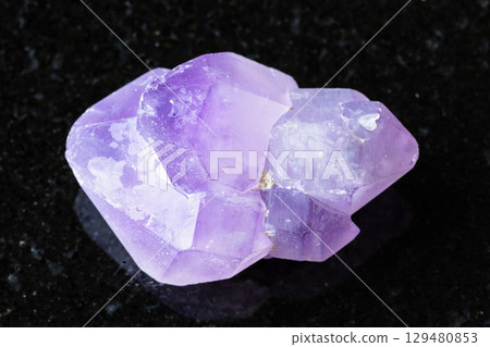sample of raw amethyst crystals on black 129480853
