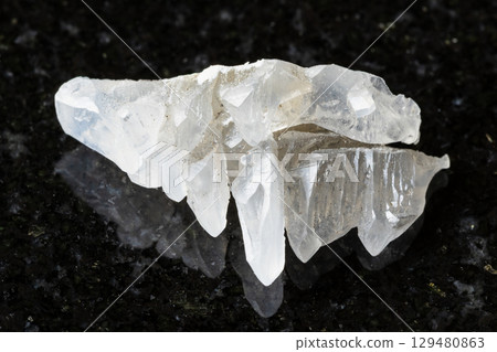 sample of raw salammoniac mineral on black granite sample of raw salammoniac mineral on black granite 129480863