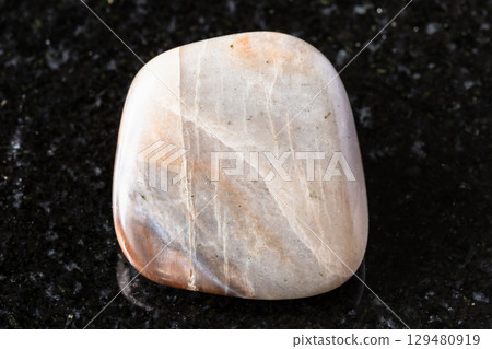 sample of polished nepheline mineral on black sample of polished nepheline mineral on black 129480919
