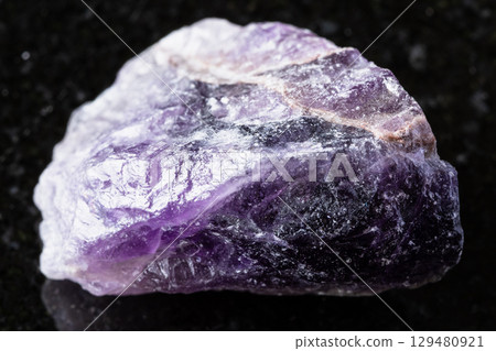 sample of unpolished amethyst mineral on black sample of unpolished amethyst mineral on black 129480921