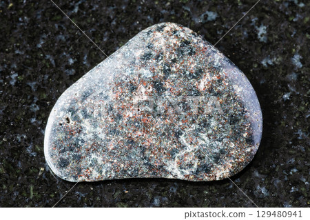 polished basalt with hematite mineral on black polished basalt with hematite mineral on black 129480941