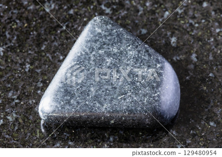 sample of polished dolerite mineral on black 129480954