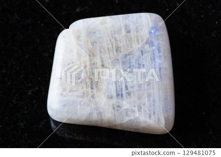 sample of polished belomorite mineral on black 129481075