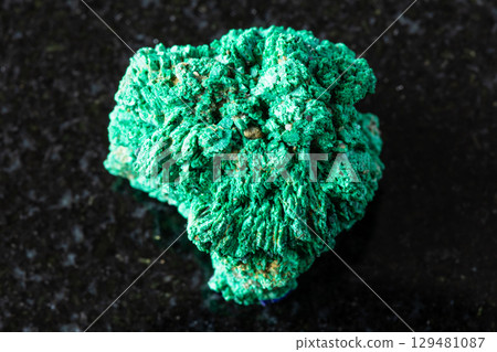 sample of crystalline malachite mineral on black 129481087