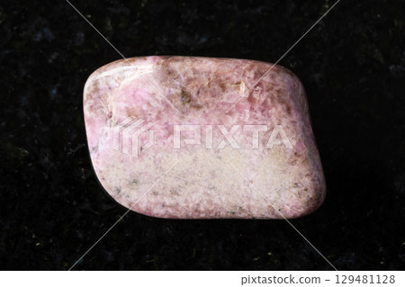 sample of polished pyroxmangite rock on black sample of polished pyroxmangite rock on black 129481128