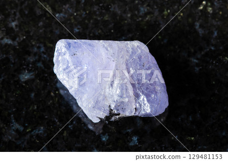sample of rough tanzanite mineral on black granite sample of rough tanzanite mineral on black granite 129481153