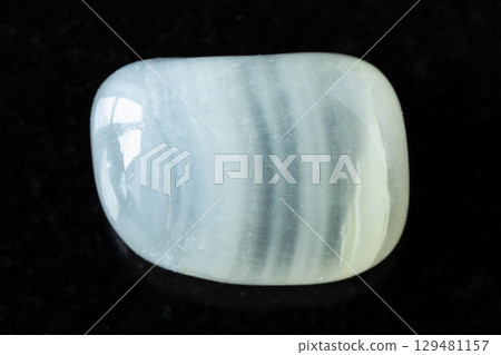 polished colorless calcite mineral on black polished colorless calcite mineral on black 129481157