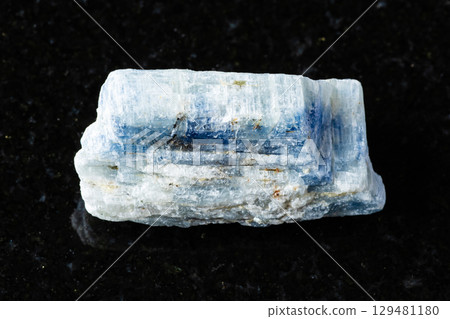 sample of rough kyanite rock on black granite sample of rough kyanite rock on black granite 129481180