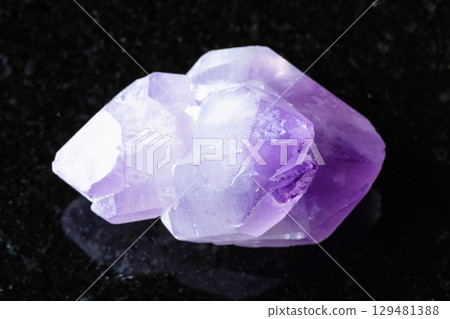 sample of rough amethyst crystals on black 129481388