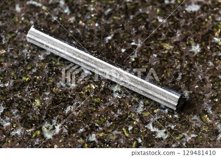 sample of rough schorl tourmaline crystal on black sample of rough schorl tourmaline crystal on black 129481410