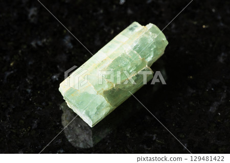 sample of rough green beryl crystal on black sample of rough green beryl crystal on black 129481422