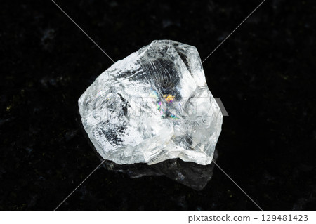 rough goshenite colorless beryl rock on black 129481423
