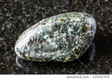 sample of polished gabbro-norite rock on black sample of polished gabbro-norite rock on black 129481470