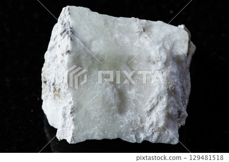 sample of raw pinnoite rock on black granite sample of raw pinnoite rock on black granite 129481518