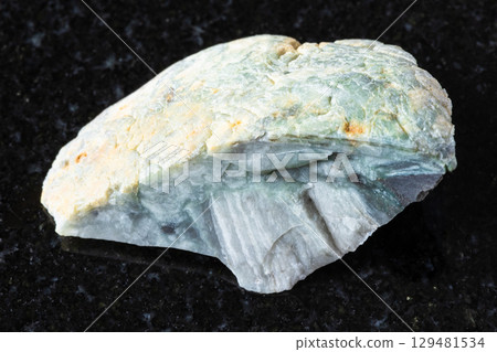 sample of raw trass chernomorite rock on black 129481534