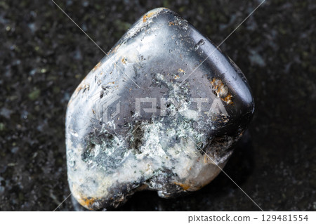 polished cleiophane and mushketovite rock on black polished cleiophane and mushketovite rock on black 129481554
