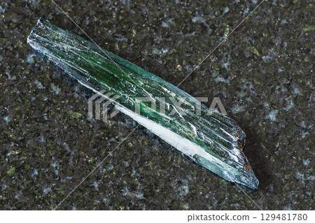 sample of rough vivianite crystal on black granite sample of rough vivianite crystal on black granite 129481780