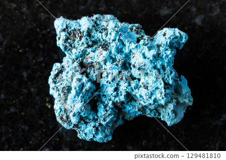 sample of rough shattuckite mineral on black 129481810