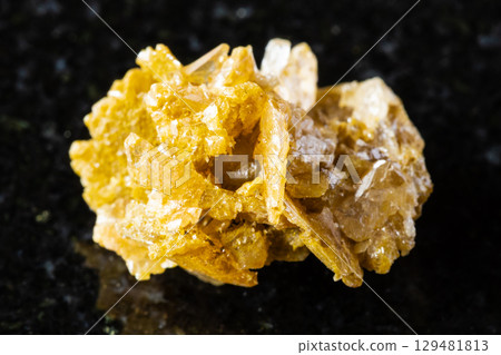 sample of raw cerussite rock on black granite sample of raw cerussite rock on black granite 129481813