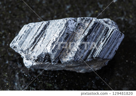 sample of raw tourmaline schorl mineral on black sample of raw tourmaline schorl mineral on black 129481820