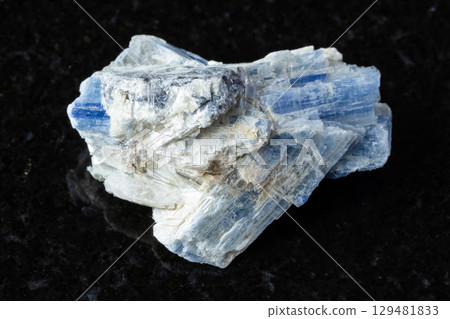 sample of unworked kyanite mineral on black sample of unworked kyanite mineral on black 129481833