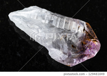 sample of raw amethyst quartz crystal on black sample of raw amethyst quartz crystal on black 129481849