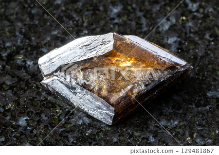sample of rough twinned titanite crystal on black sample of rough twinned titanite crystal on black 129481867