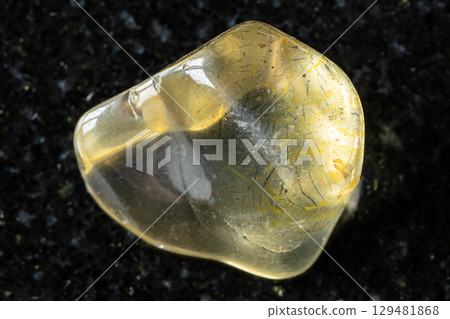 tumbled transparent orthoclase mineral on black tumbled transparent orthoclase mineral on black 129481868