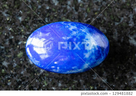 sample of polished lapis lazuli gemstone on black 129481882