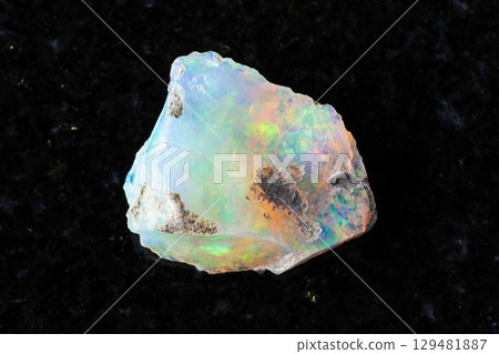 sample of rough ethiopian opal mineral on black sample of rough ethiopian opal mineral on black 129481887