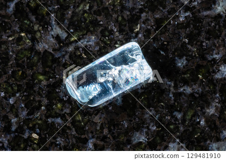 sample of rolled aquamarine crystal on black 129481910