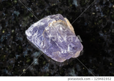 sample of unpolished iolite crystal on black 129481932