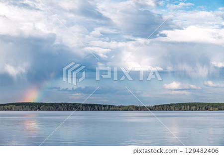 Blue lake with cloudy sky, natural background 129482406