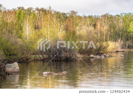 Blue lake with cloudy sky, natural background Blue lake with cloudy sky, natural background 129482434