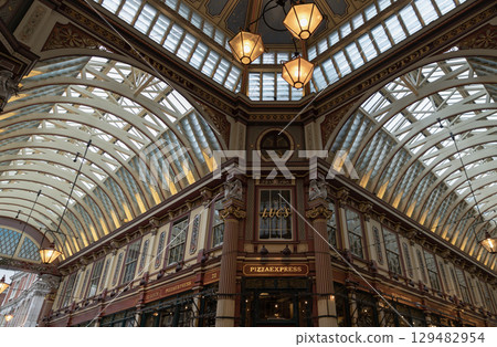 Victorian architecture of Leadenhall Market is housed beneath, is a combination of ornate wrought-iron, glass roof. 129482954